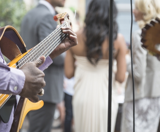 person playing guitat at a wedding party