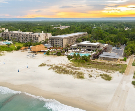 aerial shot of beach house resort and beach