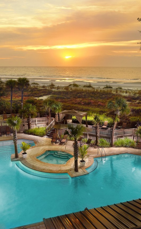 pool with a sunset behind