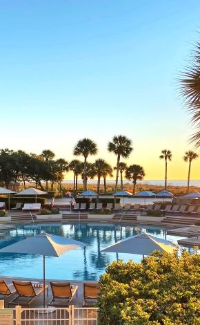 westin pool with umbrellas and palm trees
