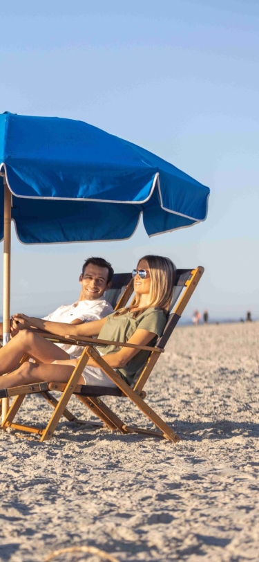 couple laying on lounge chair 