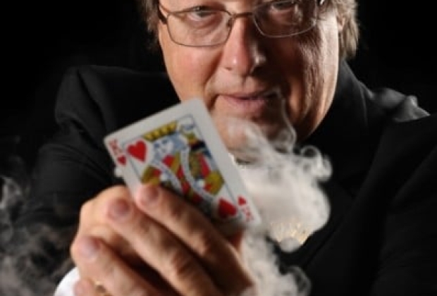 Magician showing his card