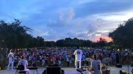 Deas Guyz performing on stage at night to a full live audience