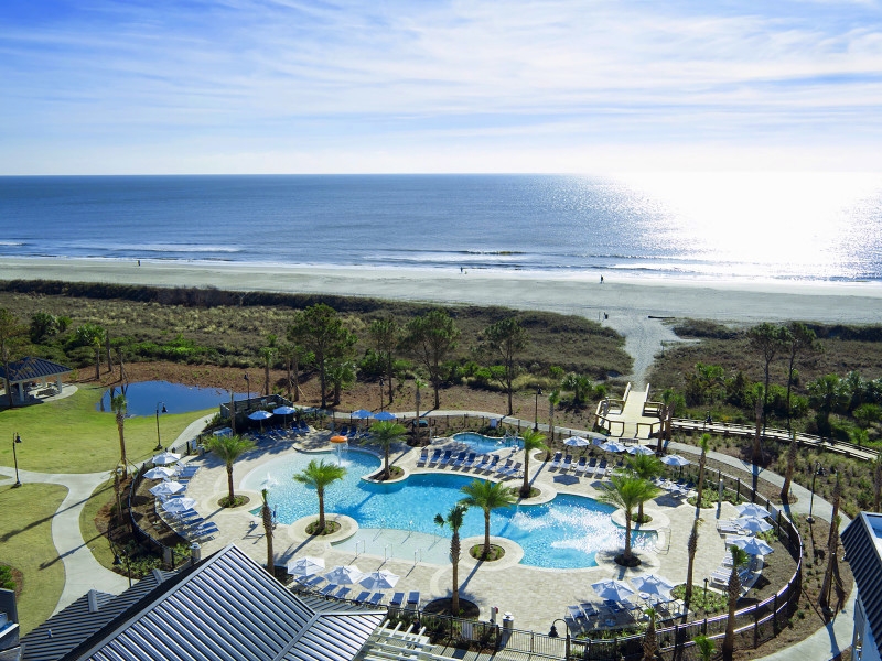 Exterior pool area leading to beach