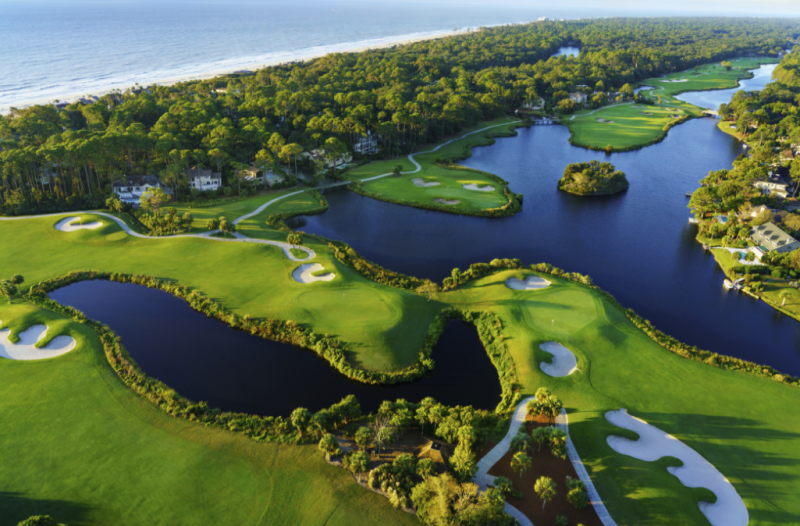 Aerial view of golf course greens with water features