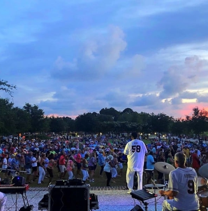 Deas Guyz performing on stage at night to a full live audience